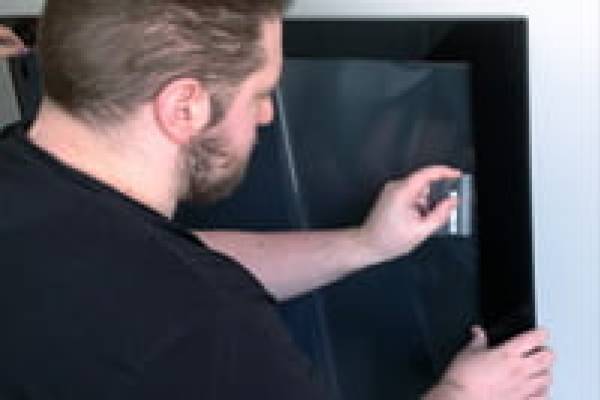 Anti-glare, Anti-microbial, and Anti-fingerprint Film installation on television